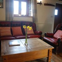 Comfortable leather sofa in The Hayloft