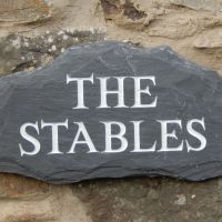 The Stables slate sign